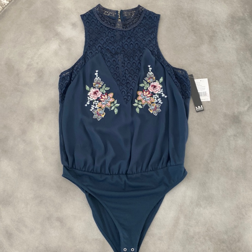 NWT women’s blue embroidered lace bodysuit/blouse size Medium.